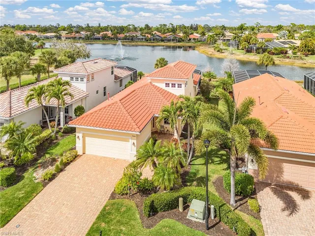 Aerial perspective of suburban area with a nearby body of water