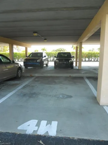 Garage featuring covered parking