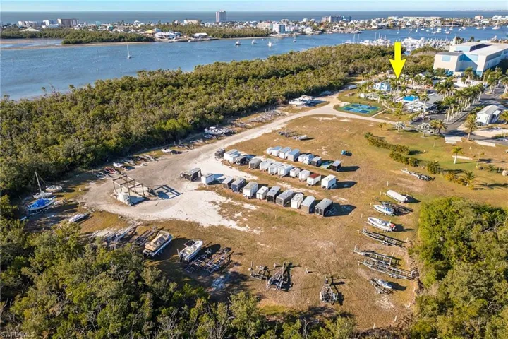 Aerial overview of property's location with a large body of water