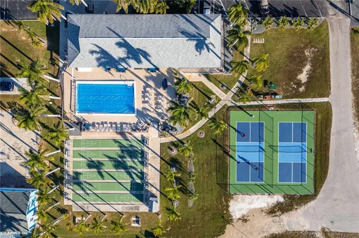 View of subject property with a pool area
