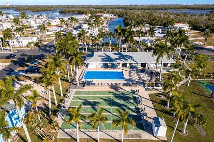 Aerial view of residential area featuring a large body of water