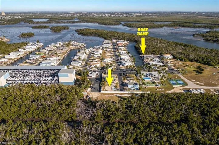Aerial perspective of suburban area with a nearby body of water