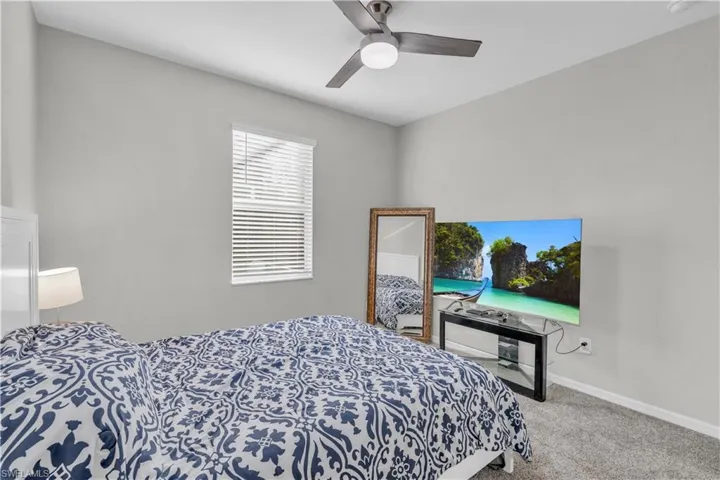 Bedroom featuring carpet flooring and ceiling fan