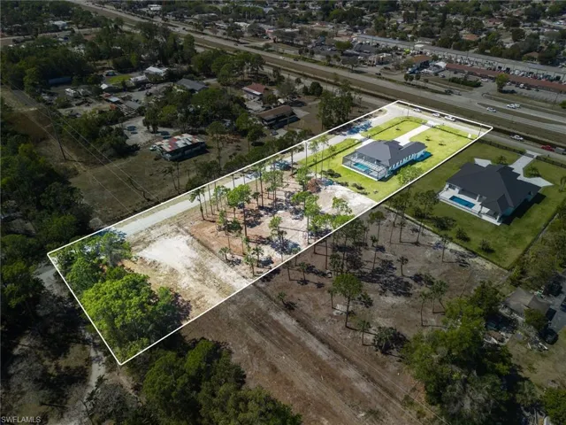 Aerial view of residential area with property boundaries highlighted.