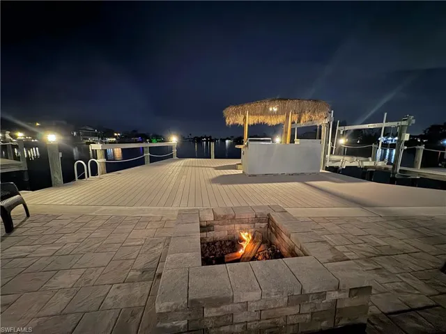 Night time views of tiki and fire pit