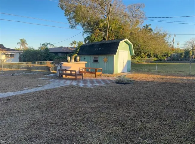 Fenced backyard with a shed