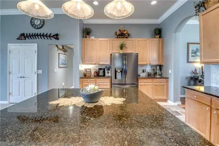To the left of picture is 2 door Pantry with Pull out drawers