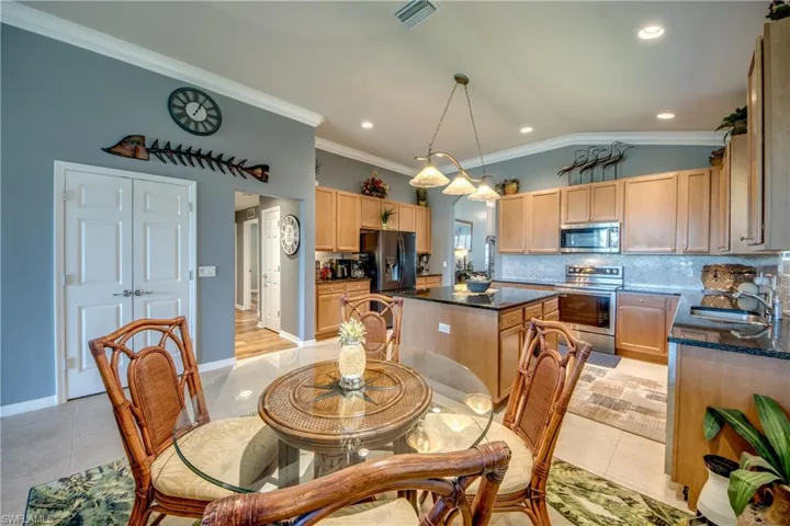 Dinette Area is open to kitchen,  in the rear is double door pantry with pull out drawers