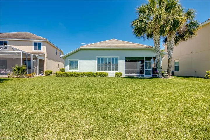 Large back yard leading down to Lake