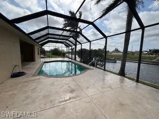 Outdoor pool featuring a patio area and a lanai