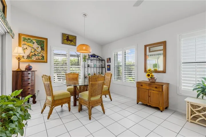 Dining space with a wealth of natural light, lofted ceiling