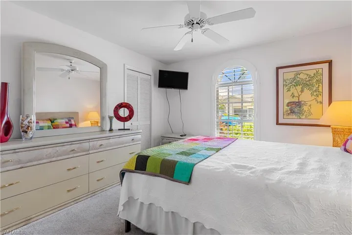 Bedroom featuring a closet, carpet floors, and ceiling fan