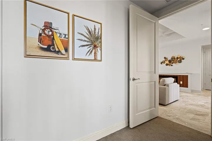 Corridor featuring baseboards and recessed lighting