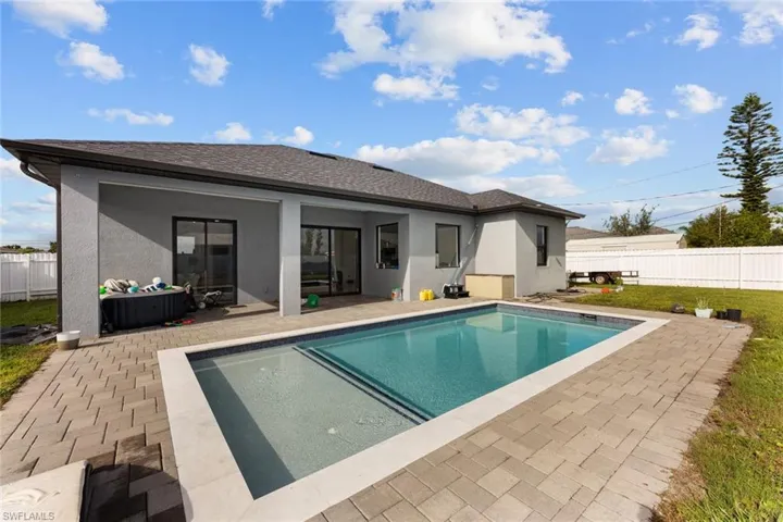 View of swimming pool featuring a patio