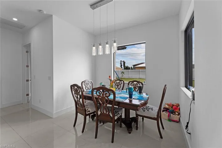 Dining room featuring plenty of natural light and light tile floors