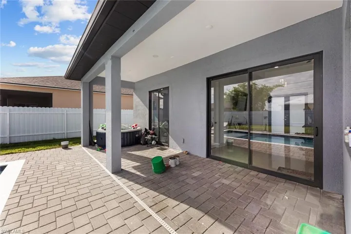 View of terrace featuring a pool with hot tub