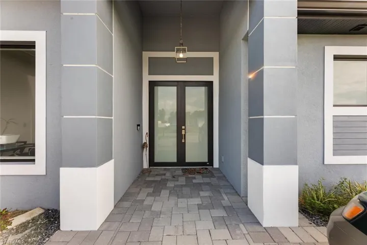 Property entrance with french doors