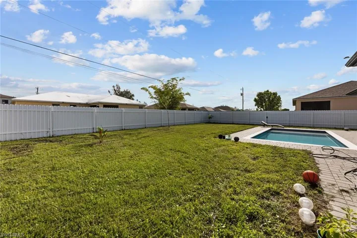 View of yard featuring a fenced in pool