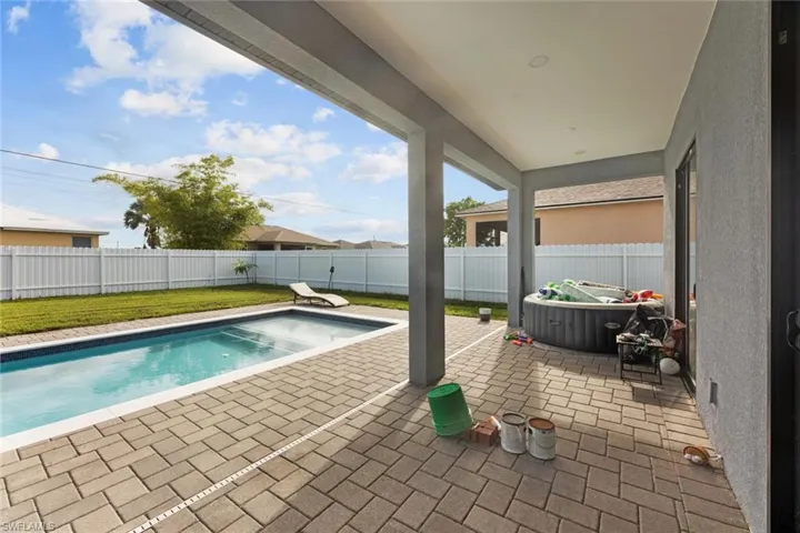 View of swimming pool featuring a yard and a patio