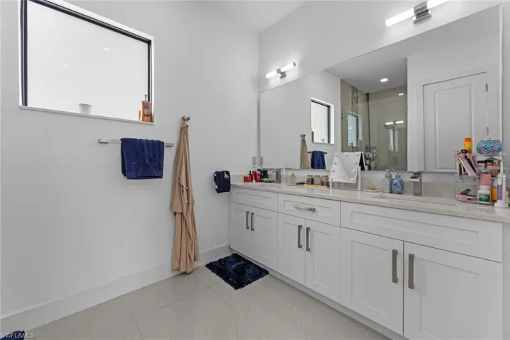 Bathroom featuring tile flooring and vanity