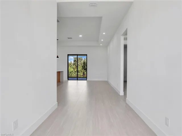 Hall featuring recessed lighting and light wood-type flooring