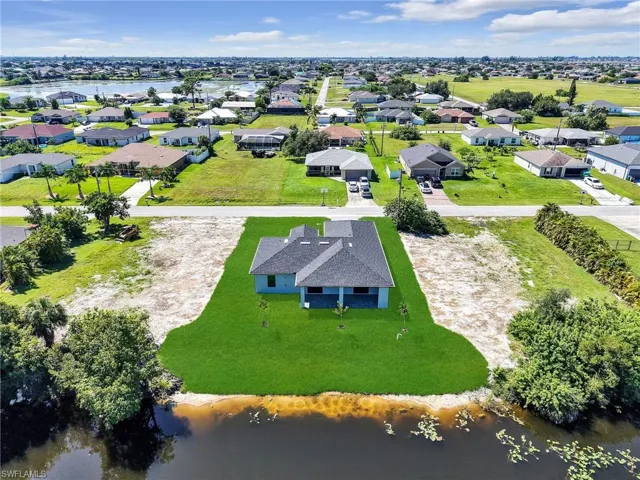 Aerial view of residential area with a large body of water