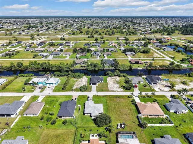 View of property location with nearby suburban area
