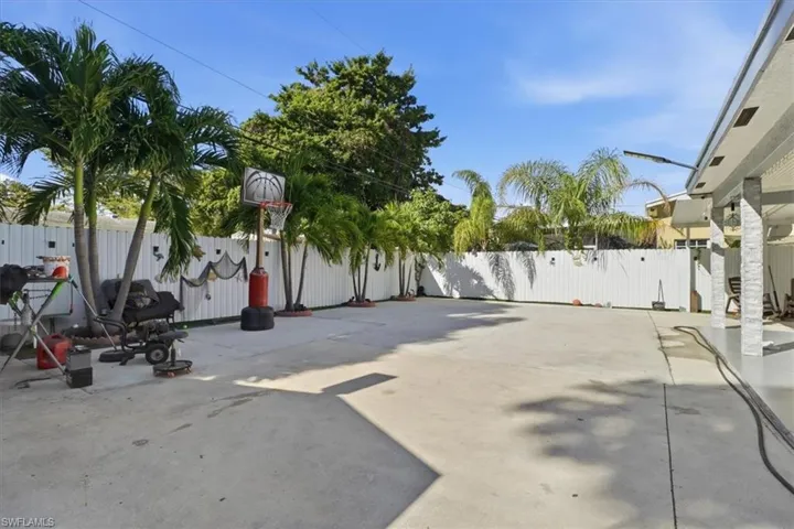 Fenced backyard with a patio area