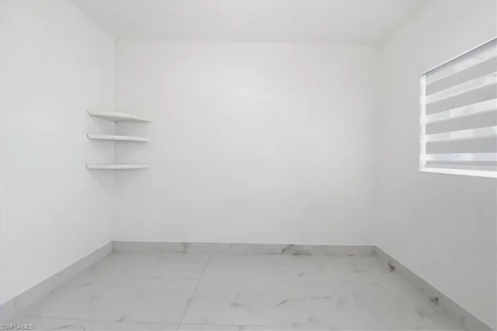 Empty room with light marble finish floors