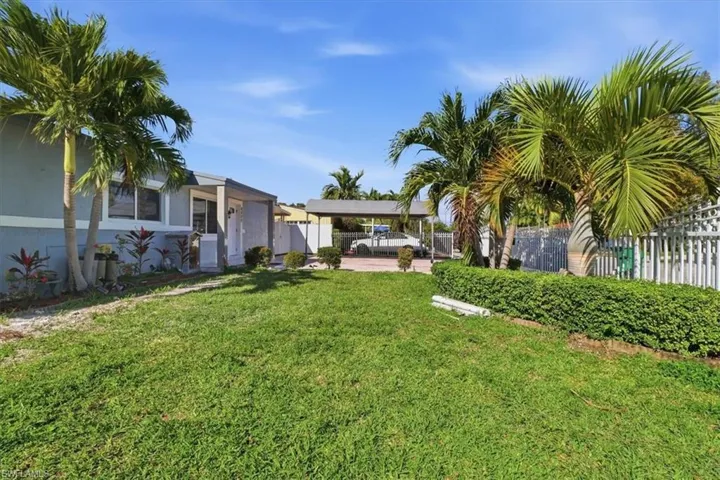 View of yard with a carport