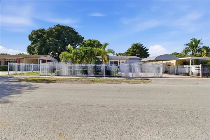Ranch-style house with a fenced front yard
