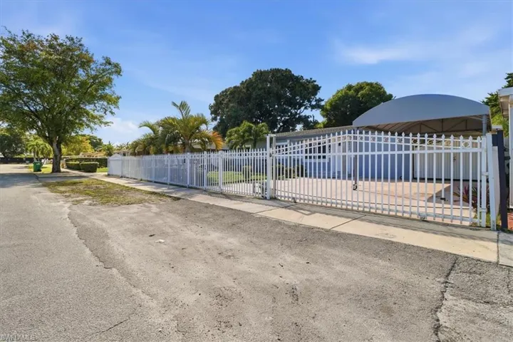 Gate with a fenced front yard