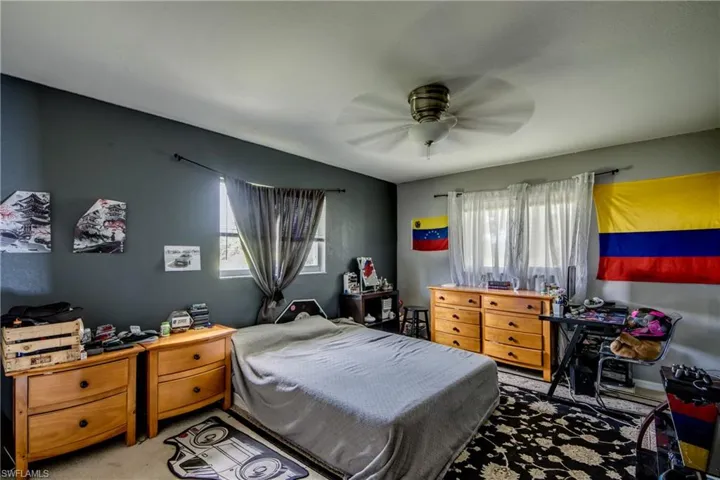 Bedroom featuring carpet flooring and ceiling fan