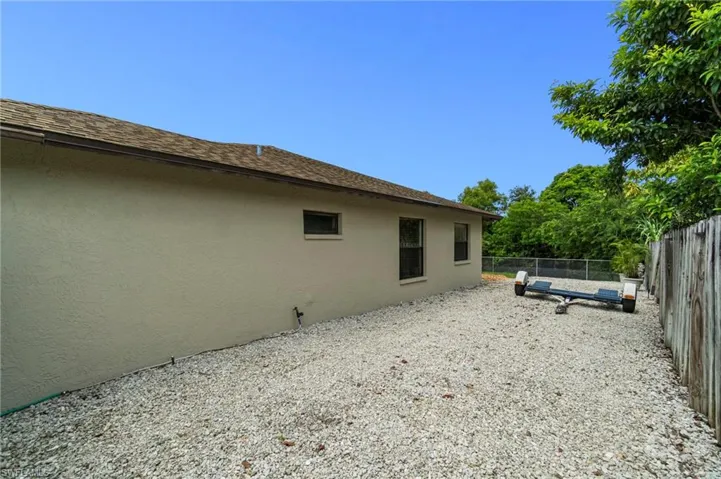 Great space on the east side of property to park vehicles, RV, boat, whatever you wish! The west side of the house also has significant space for the same.