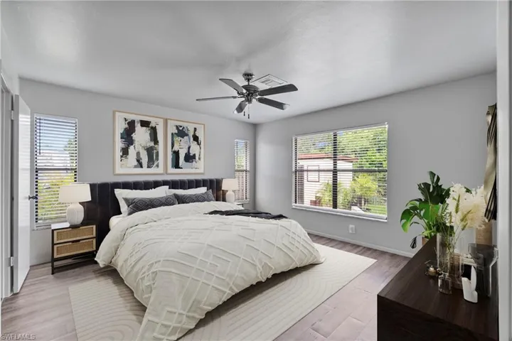 Primary bedroom. Room has been virtually staged to showcase potential furniture design layout.