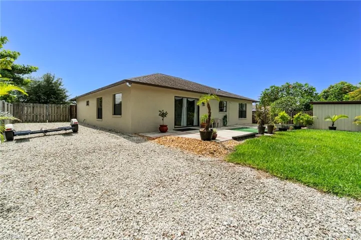 Great space on the east side of property to park vehicles, RV, boat, whatever you wish! The west side of the house also has significant space for the same.