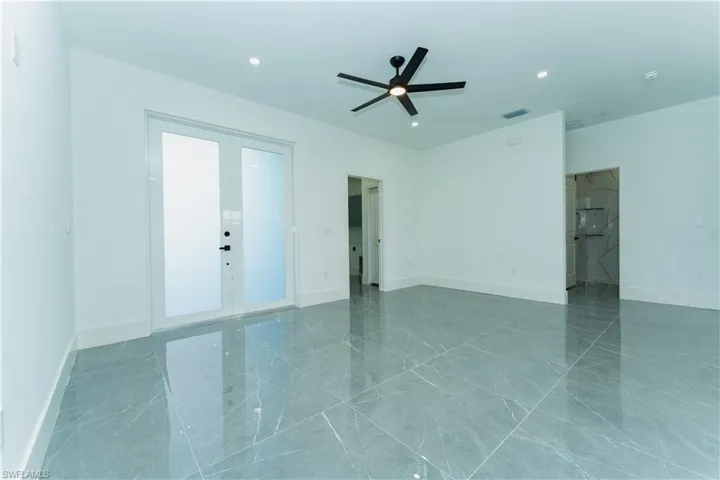 Empty room with baseboards, recessed lighting, and ceiling fan