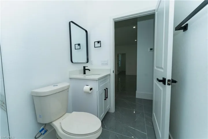 Bathroom with vanity and toilet