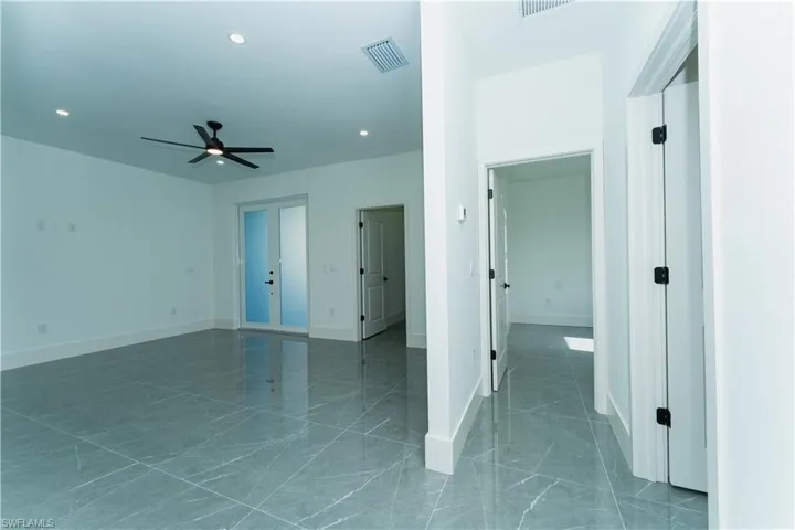 Unfurnished room featuring ceiling fan, recessed lighting, and baseboards