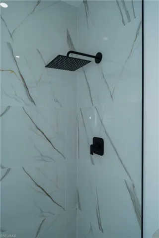 Bathroom view of a marble finish shower