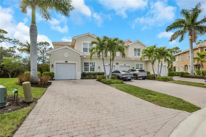 Mediterranean / spanish-style house featuring decorative driveway, stucco siding, and an attached garage