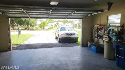 Garage wit a garage door opener.