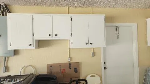 Garage cabinets and side door.