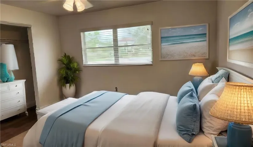 Bedroom featuring laminate flooring, a closet, and ceiling fan
