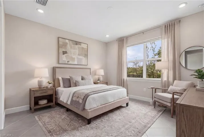 Virtual Bedroom with recessed lighting and light tile patterned floors