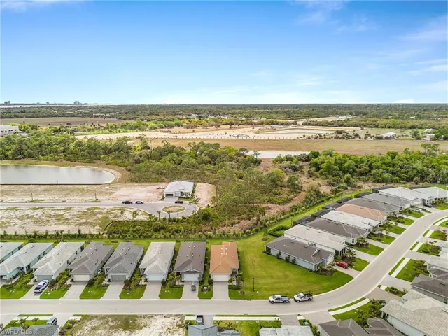 Aerial view of residential area with a large body of water
