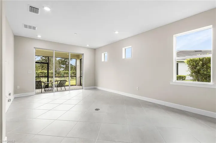 Unfurnished Gathering room featuring healthy amount of natural light, recessed lighting, and light tile patterned flooring