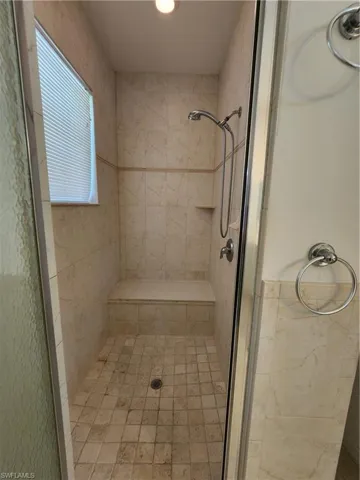 Bathroom featuring a shower with shower door