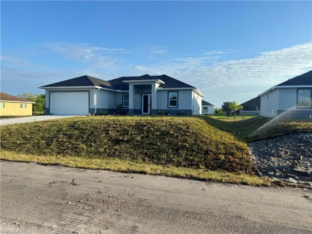Single story home with a garage