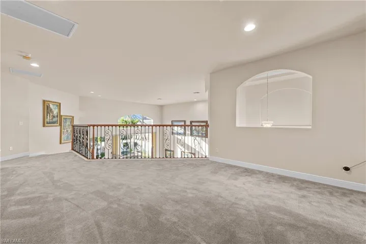 Empty room featuring carpet flooring